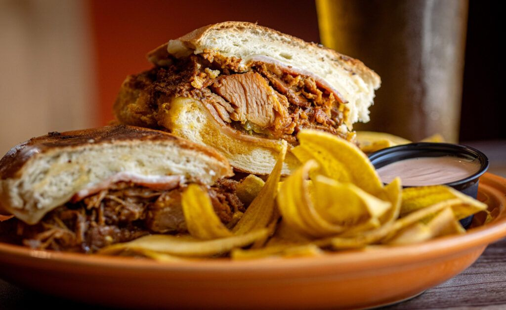 Cubano sandwich with slow roasted pork, ham, Swiss cheese, pickles, mayonnaise and mustard on a flat pressed French roll from El Coqui Puerto Rican Cuisine Friday, May 8, 2026 in downtown Santa Rosa. (John Burgess/The Press Democrat)