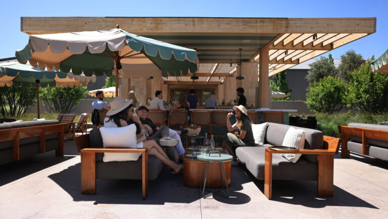 Guests taste wine at the outdoor Wren Bar patio, located at Bella Union Winery, Saturday, May 9, 2026, in Rutherford. (Kent Porter / The Press Democrat)