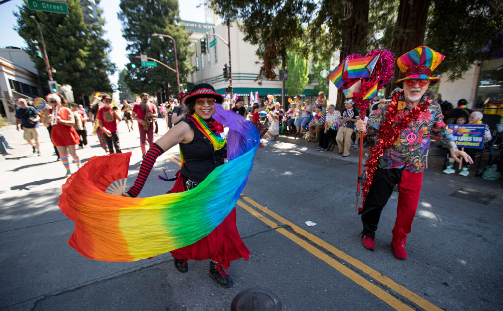 Juanita Watkins of Cotati, and Craig Mason of Santa Rosa, lead the "Hubbub Club" as they march in the parade during the 2025 Sonoma County Pride Parade in Santa Rosa on Saturday, May 31, 2025. (Darryl Bush / For The Press Democrat)