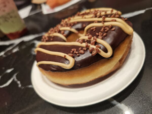 Gone Bananas doughnut at SoCo Dough Co. at the Graton Resort & Casino includes banana pudding, chocolate glaze, peanut butter, chocolate crispies and caramelized banana. (Heather Irwin/The Press Democrat)