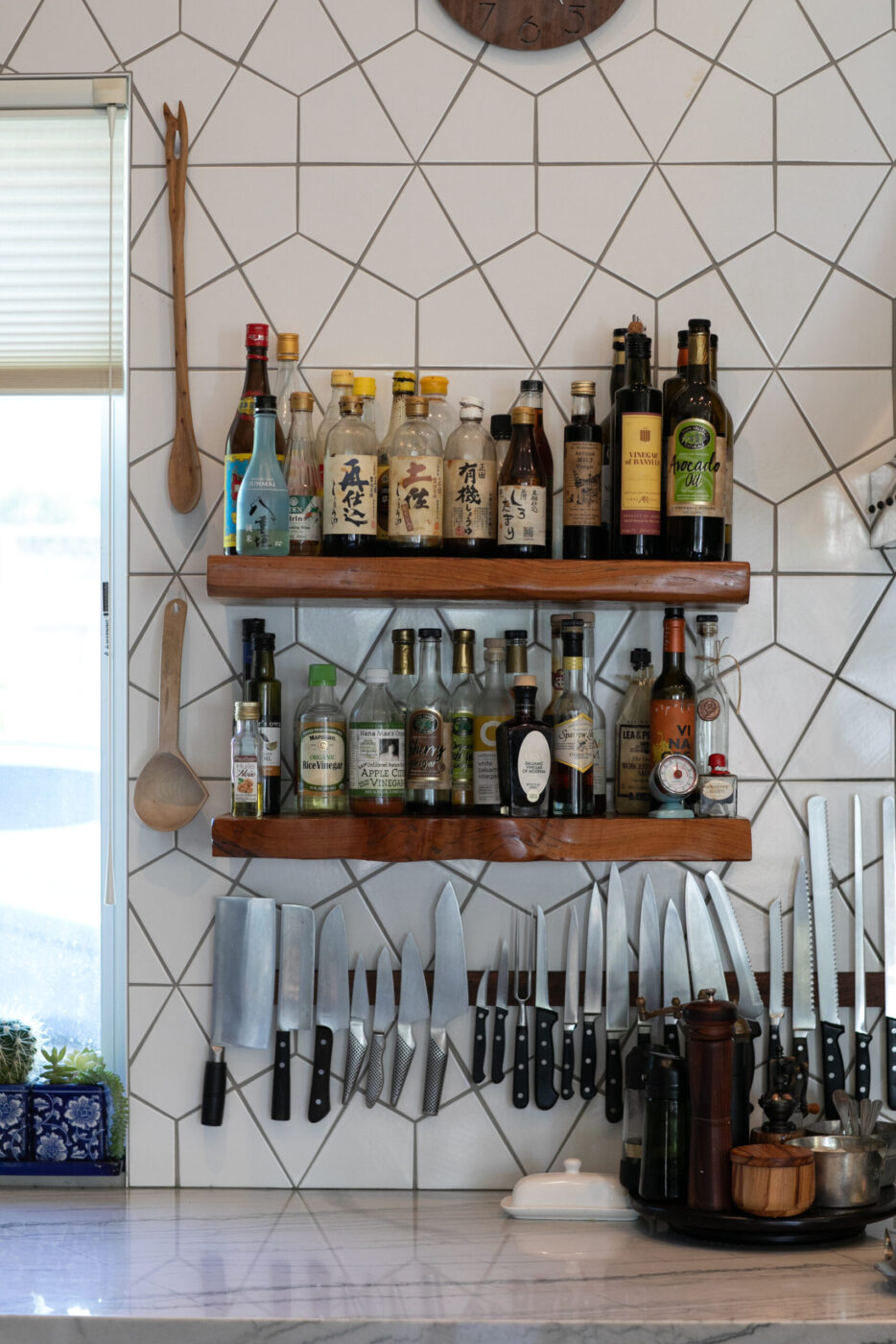 A selection of vinegars and oils are always within easy reach in the indoor kitchen. (Eileen Roche)