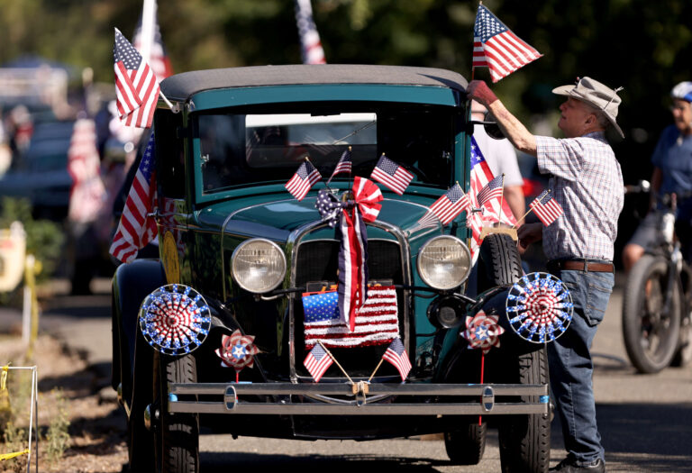 Don Meador from Oakmont spruces up his 1931 Ford Model A with red, white and blue, prior to the Kenwood Hometown Fourth of July Parade, Thursday July 4, 2024. (Kent Porter / The Press Democrat) 2024