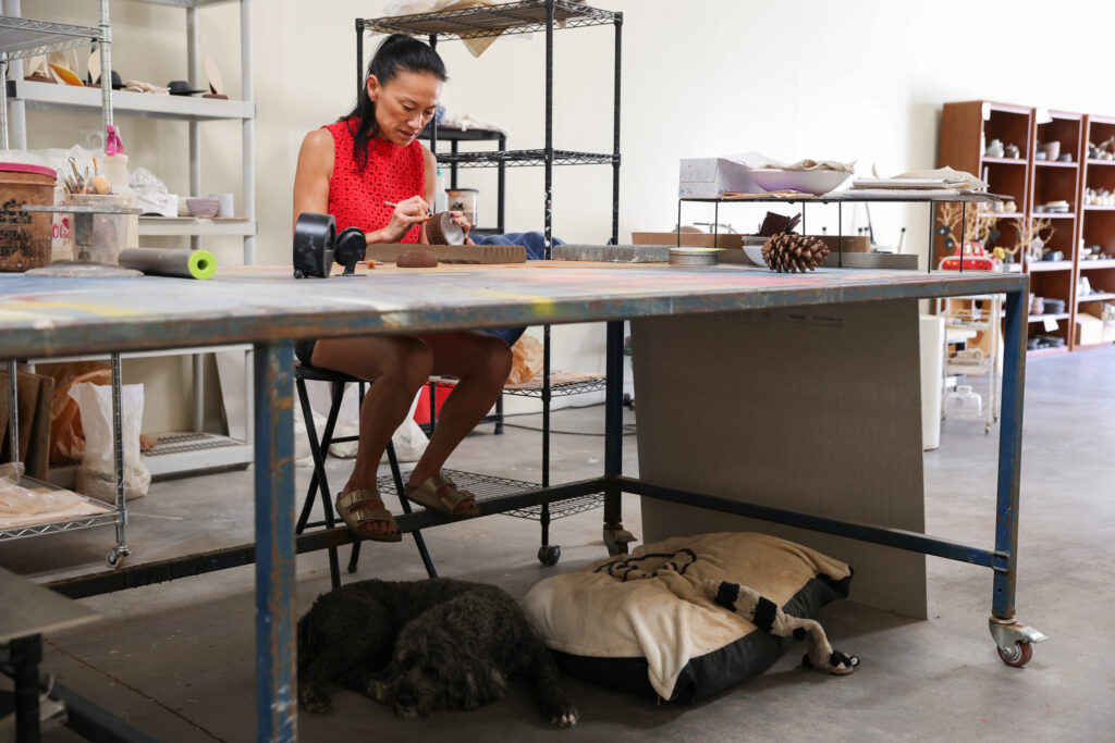 Jee Park, of Seoul Sister Studio, works on etching a clay bowl at her studio in Healdsburg on Thursday, March 19, 2026. (Christopher Chung/The Press Democrat)