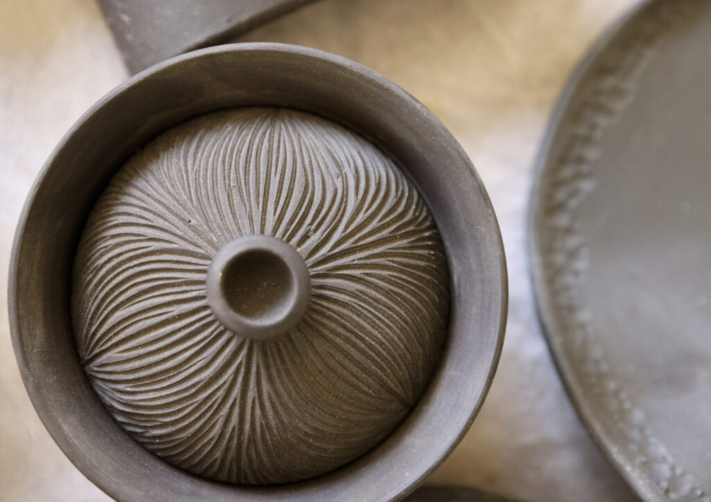 Intricate designs etched into a ceramic piece by Jee Park, of Seoul Sister Studio, in Healdsburg on Thursday, March 19, 2026. (Christopher Chung/The Press Democrat)