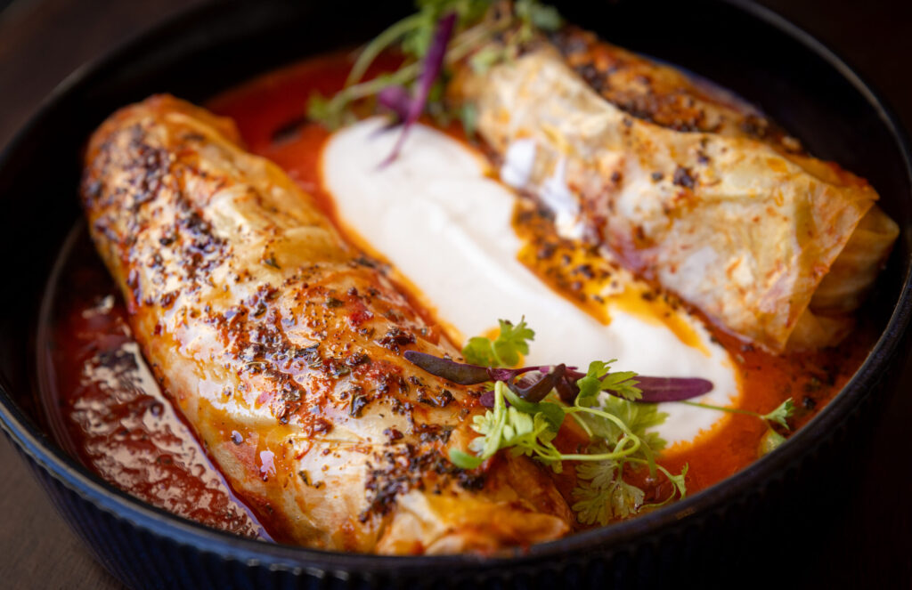 Cabbage Dolma with ground beef, rice, herbs, garlic yogurt, brown butter and marinara sauce from Alesta Modern Mediterranean Wednesday, June 3, 2026 in Sebastopol. (John Burgess/The Press Democrat)