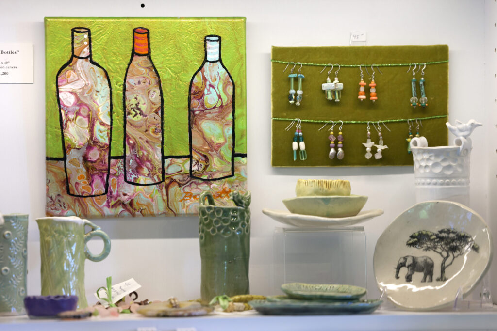 Paintings, pottery and jewelry made by Heidi Peterson Barrett on display for sale at La Sirena tasting room in Calistoga Wednesday, May 13, 2026. (Beth Schlanker / The Press Democrat)