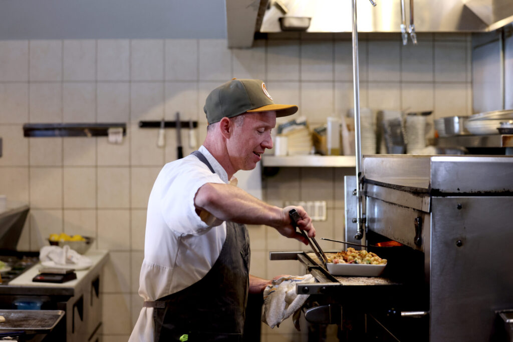 Seared co-owner Joe O’Donnell cooks a Lobster Mac n’ Cheese at Seared in Petaluma Thursday, June 18, 2026. (Beth Schlanker / The Press Democrat)