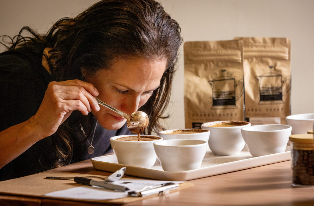 Bibiana Gonzalez stirs the grounds, lifts and smells each of the roasting variation during the Shared Notes Coffee tasting experience at the Wines by Bibiana tasting room Monday, June 8, 2026 in Rohnert Park. (John Burgess/The Press Democrat)