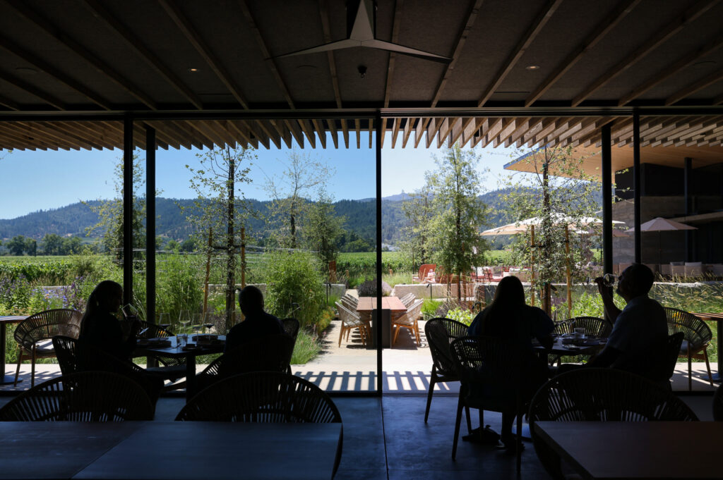 Guests sip wine and dine in the new Garden Room at Robert Mondavi Winery in Oakville on Wednesday, June 24, 2026. (Christopher Chung/The Press Democrat)