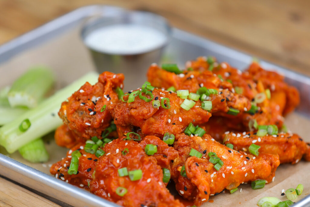 Twelve Piece Nacho Sauce Wings at Wonderland Pizzeria in Monte Rio on Wednesday, June 17, 2026. (Christopher Chung/The Press Democrat)