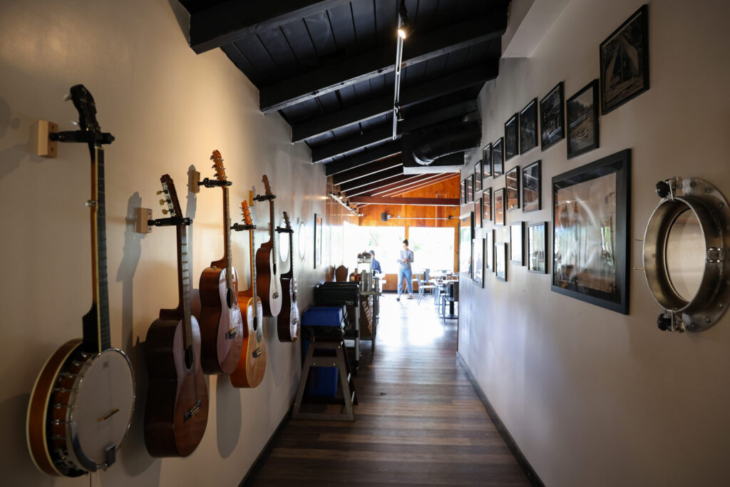 Guitars on the wall at Wonderland Pizzeria are for guests to pick up and play in Monte Rio on Wednesday, June 17, 2026. (Christopher Chung/The Press Democrat)