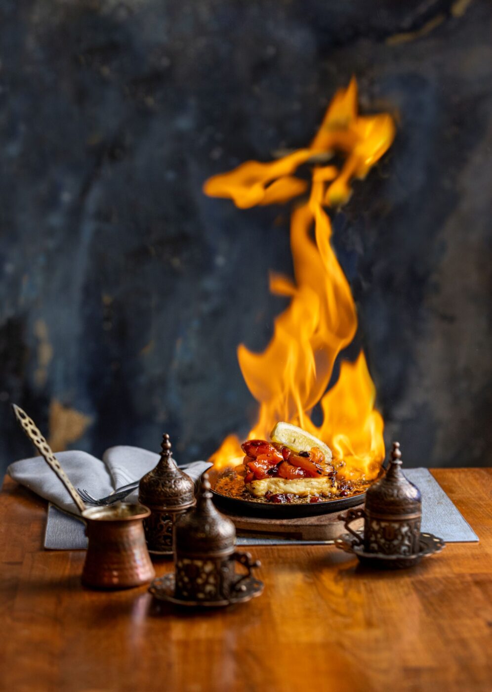 Saganaki Flambé with Cyprus halloumi cheese, citrus honey Chardonnay raisins, Turkish apricots served table side with a dramatic brandy flambé from Kalimera Bar & Grill Tuesday, April 7, 2026 in Santa Rosa. (John Burgess/The Press Democrat)