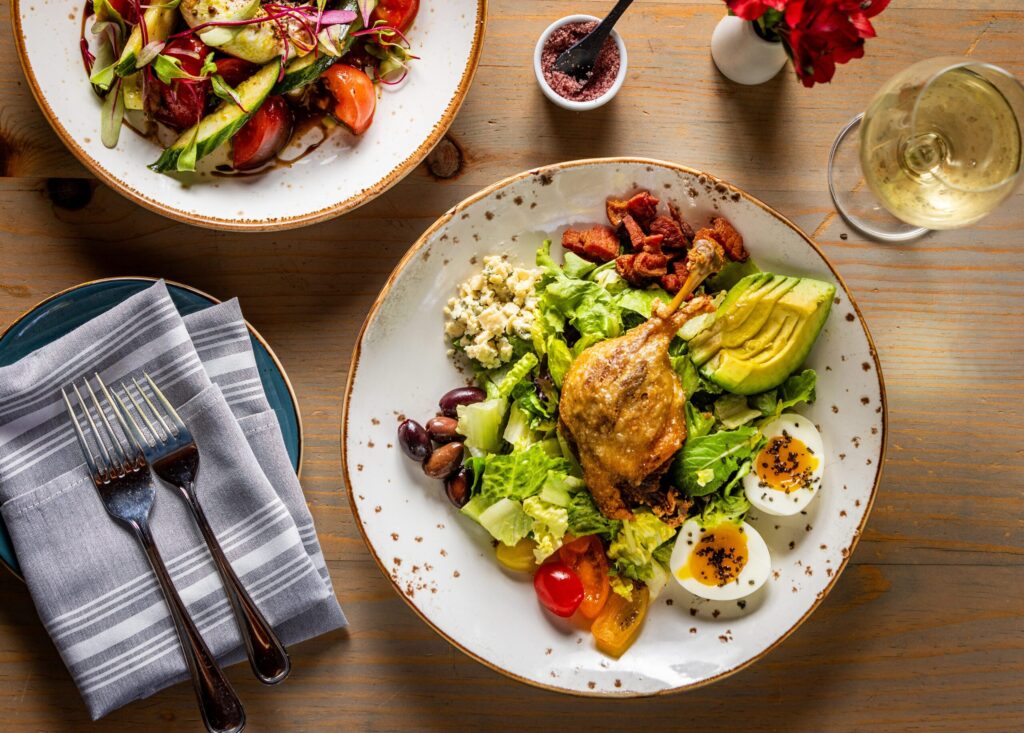 Duck Leg Confit Cobb Salad with baby mixed lettuce, avocado, tomato, lardons, Shaft’s blue cheese, olives, boiled egg, Dijon tarragon vinaigrette from Salt & Stone in the heart of the Sonoma Valley Monday, June 1, 2026 in Kenwood. (John Burgess/The Press Democrat)