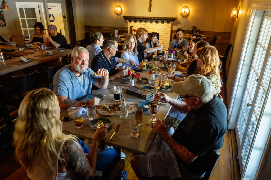 The big table at the bar for a an afternoon family gathering with cocktails and appetizers from Salt & Stone in the heart of the Sonoma Valley Monday, June 1, 2026 in Kenwood. (John Burgess/The Press Democrat)