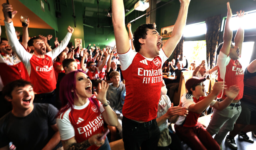 Kaitlyn and Robert Cheung of Los Angeles, celebrate a goal from the Paris Saint Germain vs Aersenal Champion League finals soccer match, via live-stream at Goose and Fern in Santa Rosa, Saturday, May 30, 2026. (Kent Porter / The Press Democrat)