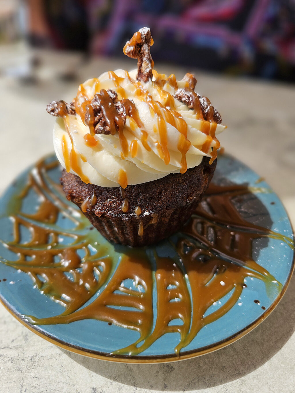 A carrot cupcake with caramel and cream cheese frosting at Salt & Stone in Kenwood. (Heather Irwin / The Press Democrat)