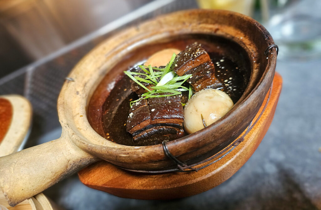 Braised pork belly in a clay pot from the Bazaar Sonoma team's Mei Mei pop-up in Healdsburg. (Heather Irwin / The Press Democrat)