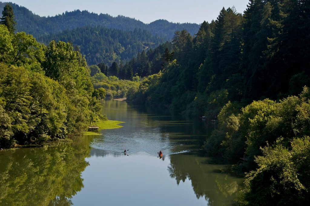 People kayak on the Russian River. (Sonoma County Tourism)