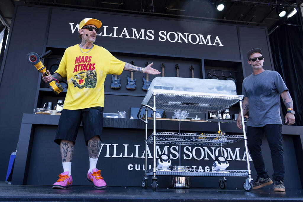 Michael Voltaggio, left, and Bryan Voltaggio are seen on the Williams Sonoma Culinary Stage at the 2025 BottleRock Napa Valley on Saturday, May 24, 2025, at Napa Valley Expo in Napa. (Amy Harris/Invision/AP)