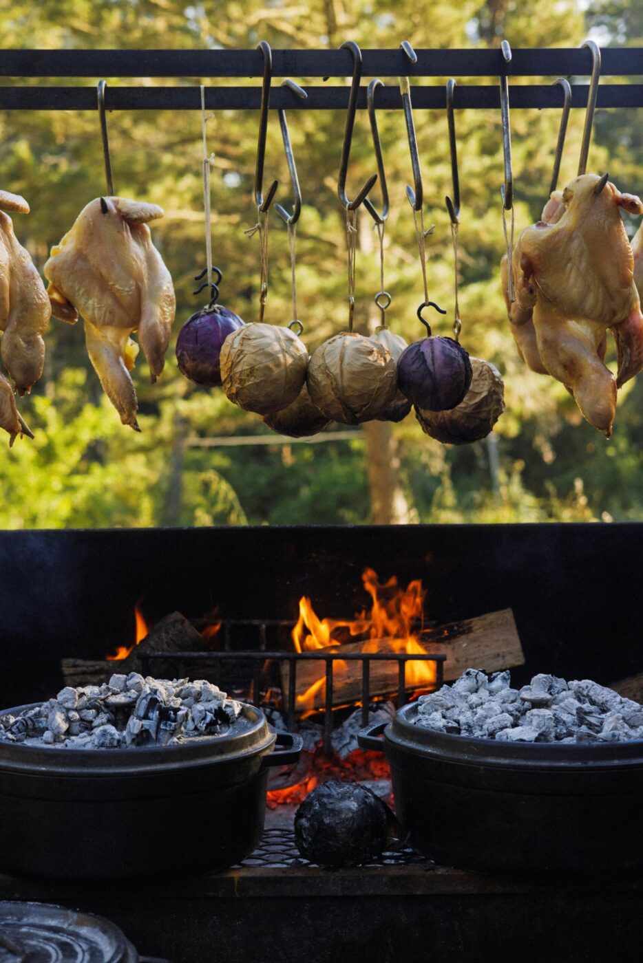 Chef Lee Desrosiers harnesses elements of campfire cooking like wood, coals and cast-iron pots to create elevated meals cooked and served outdoors. (Conor Hagen)