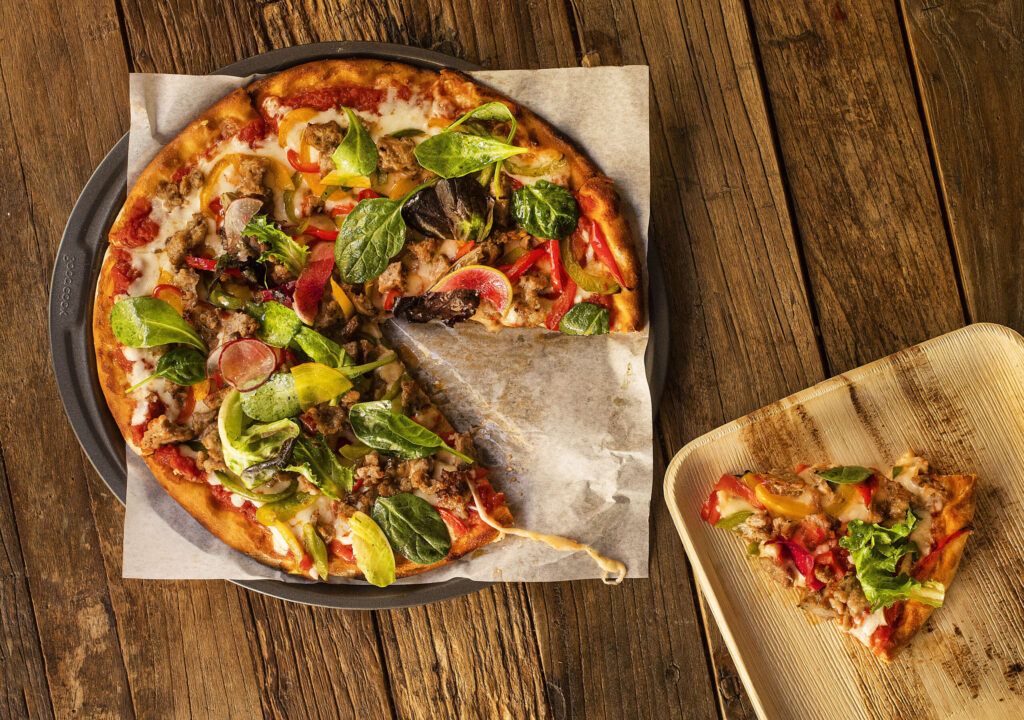 Peppers and Sweet Italian Sausage Pizza with mozzarella and bitter greens from The Mill at Glen Ellen. (John Burgess/The Press Democrat)