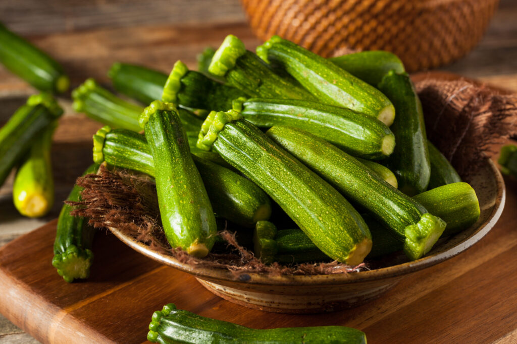 Raw Green Organic Baby Zucchini in a Bowl. (bhofack2 / Getty Images)