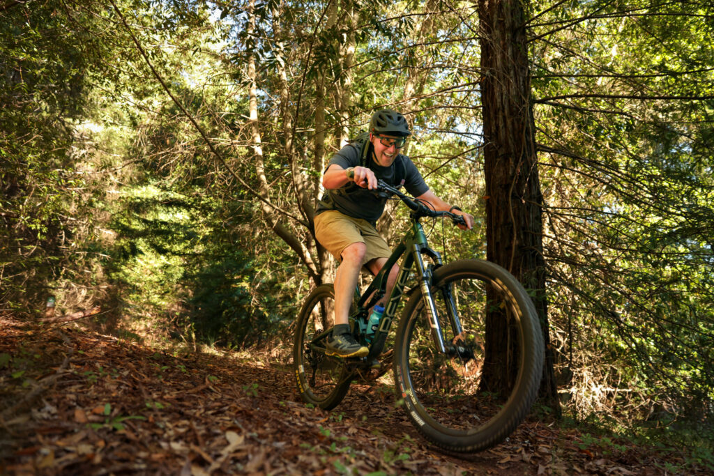 Cary Bush rides down the Office trail in the Monte Rio Redwoods Regional Park & Open Space Preserve near Occidental on Thursday, June 11, 2026. (Christopher Chung/The Press Democrat)