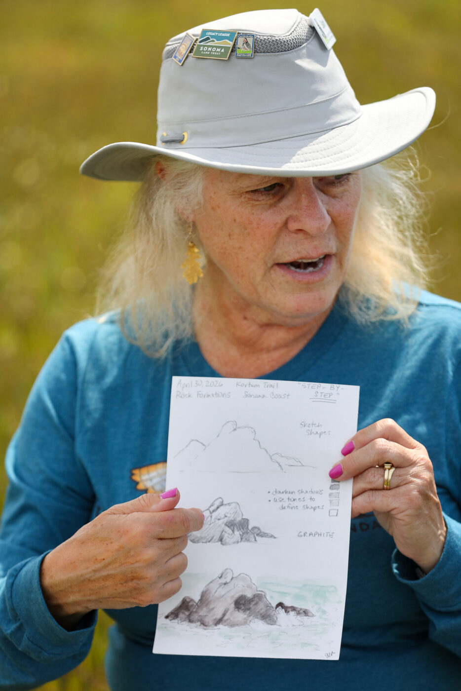 California Naturalist Sarah Reid shows a class examples while leading a Nature Journaling class on the bluffs above Shell Beach, north of Bodega Bay on Monday, May 4, 2026. (Christopher Chung/The Press Democrat)