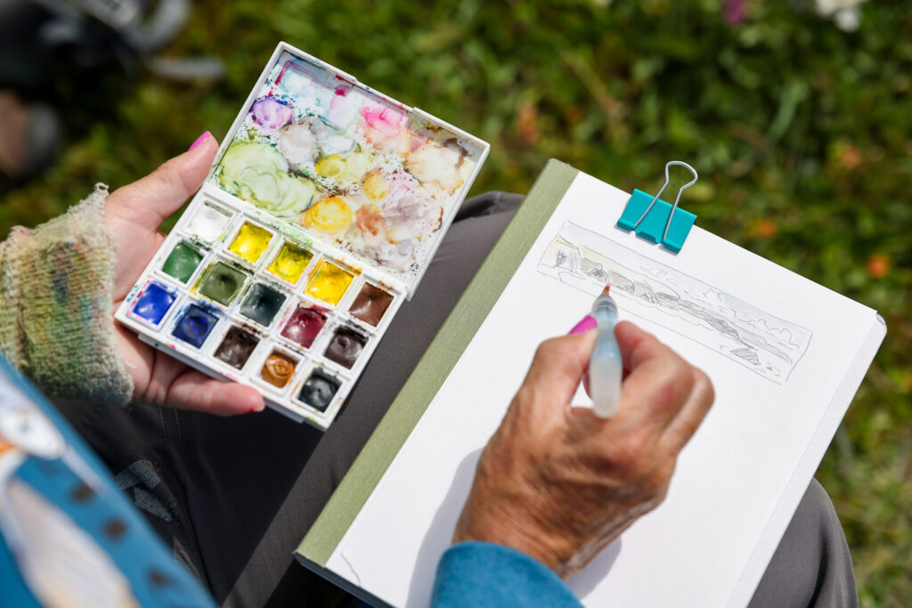California Naturalist Sarah Reid shows how to illustrate the coastal landscape and rock features while leading a Nature Journaling class on the bluffs above Shell Beach, north of Bodega Bay on Monday, May 4, 2026. (Christopher Chung/The Press Democrat)