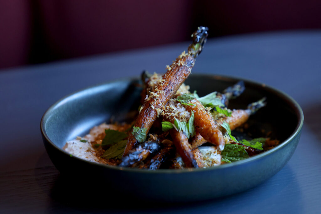 Roasted carrots with raita, molasses, crispy ginger and mint at Dead Letter restaurant in Sonoma Wednesday, July 15, 2026. (Beth Schlanker / The Press Democrat)