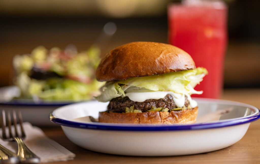 The Inglewood Burger with grass-fed beef, Toma Fonduta cheese sauce, local lettuces, Thousand Island and spicy pickle relish from Handline Thursday, July 9, 2026 in Sebastopol. (John Burgess/The Press Democrat)