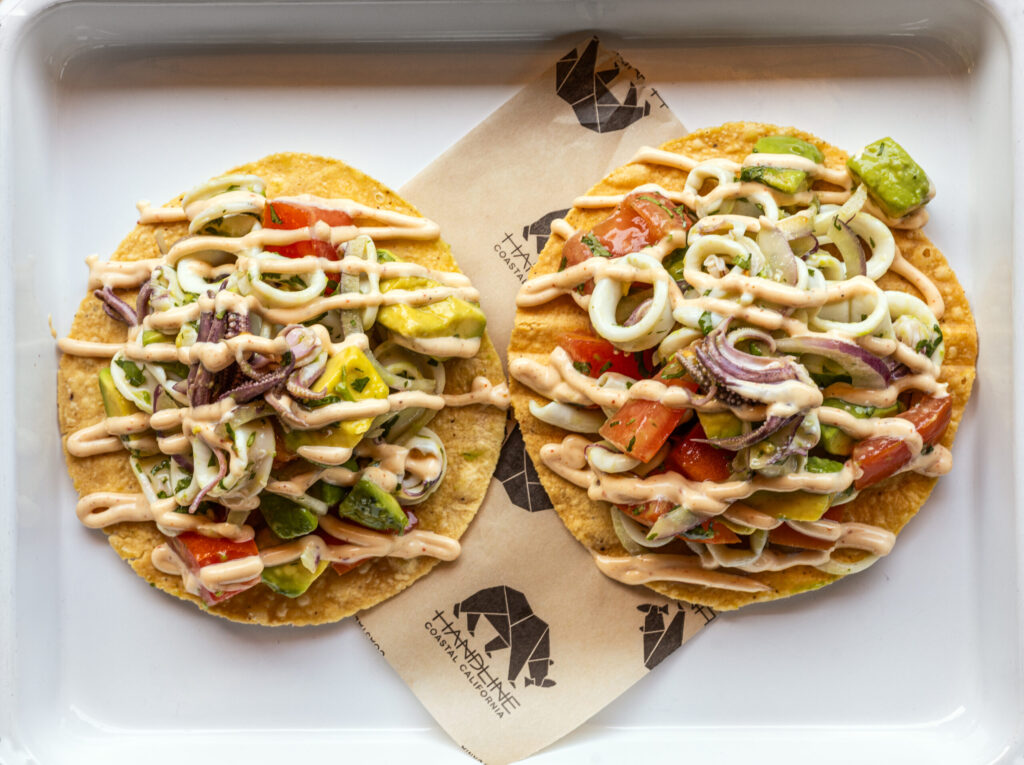 La Sirena Tostada with poached calamari, tomato, avocado, red onion, cilantro, lime and chipotle aioli from Handline Thursday, July 9, 2026 in Sebastopol. (John Burgess/The Press Democrat)