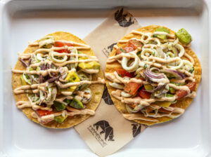 La Sirena Tostada with poached calamari, tomato, avocado, red onion, cilantro, lime and chipotle aioli from Handline Thursday, July 9, 2026 in Sebastopol. (John Burgess/The Press Democrat)