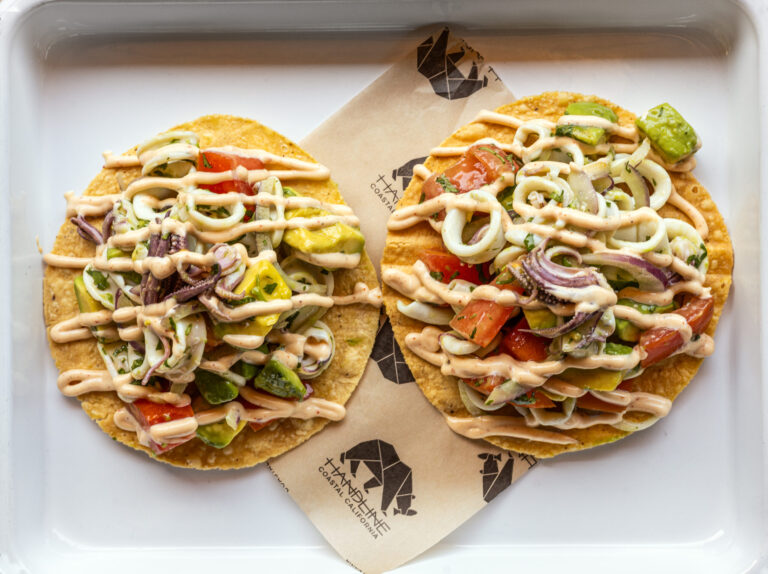 La Sirena Tostada with poached calamari, tomato, avocado, red onion, cilantro, lime and chipotle aioli from Handline Thursday, July 9, 2026 in Sebastopol. (John Burgess/The Press Democrat)