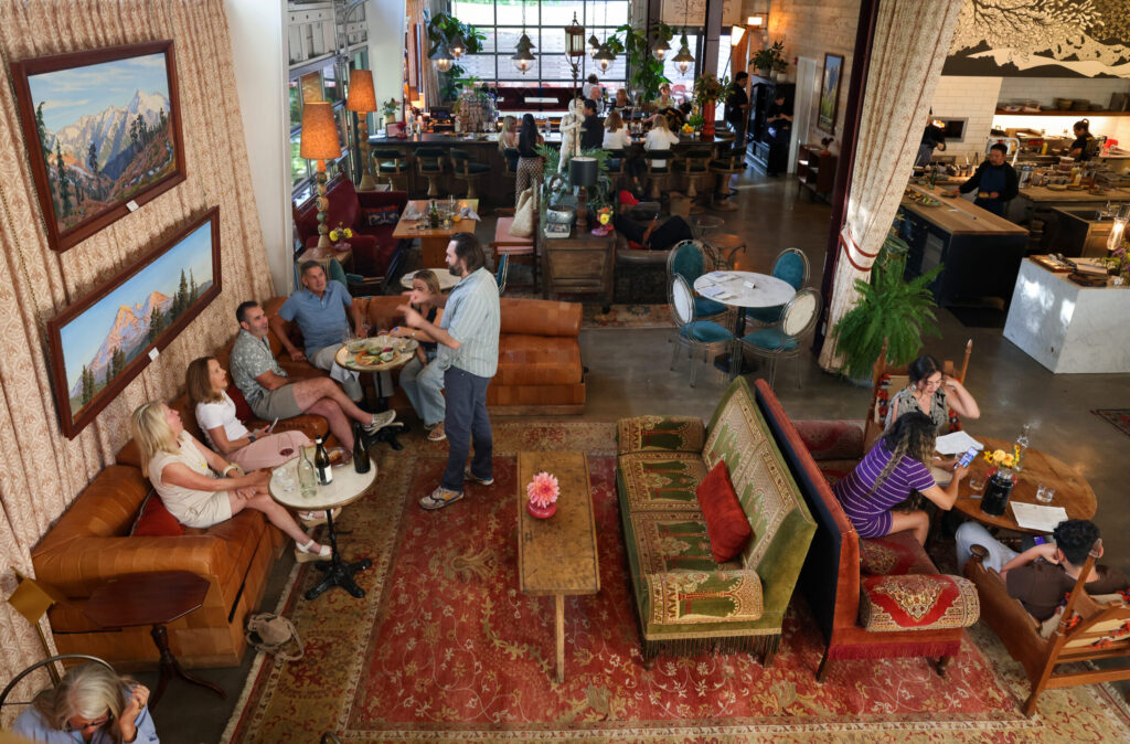 Guests dine and drink in the first floor dining and lounge area at Little Saint in Healdsburg on Thursday, July 9, 2026. (Christopher Chung/The Press Democrat)