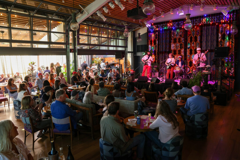 Tae & The Neighborly perform in front of a full crowd at Little Saint in Healdsburg on Thursday, July 9, 2026. (Christopher Chung/The Press Democrat)