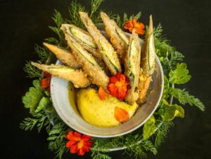 Farm Summer Squash with golden glory puree, oven fried zucchini, charred scallion, lemon, gochujang and nutmeg from Little Saint in Healdsburg. (John Burgess/The Press Democrat)