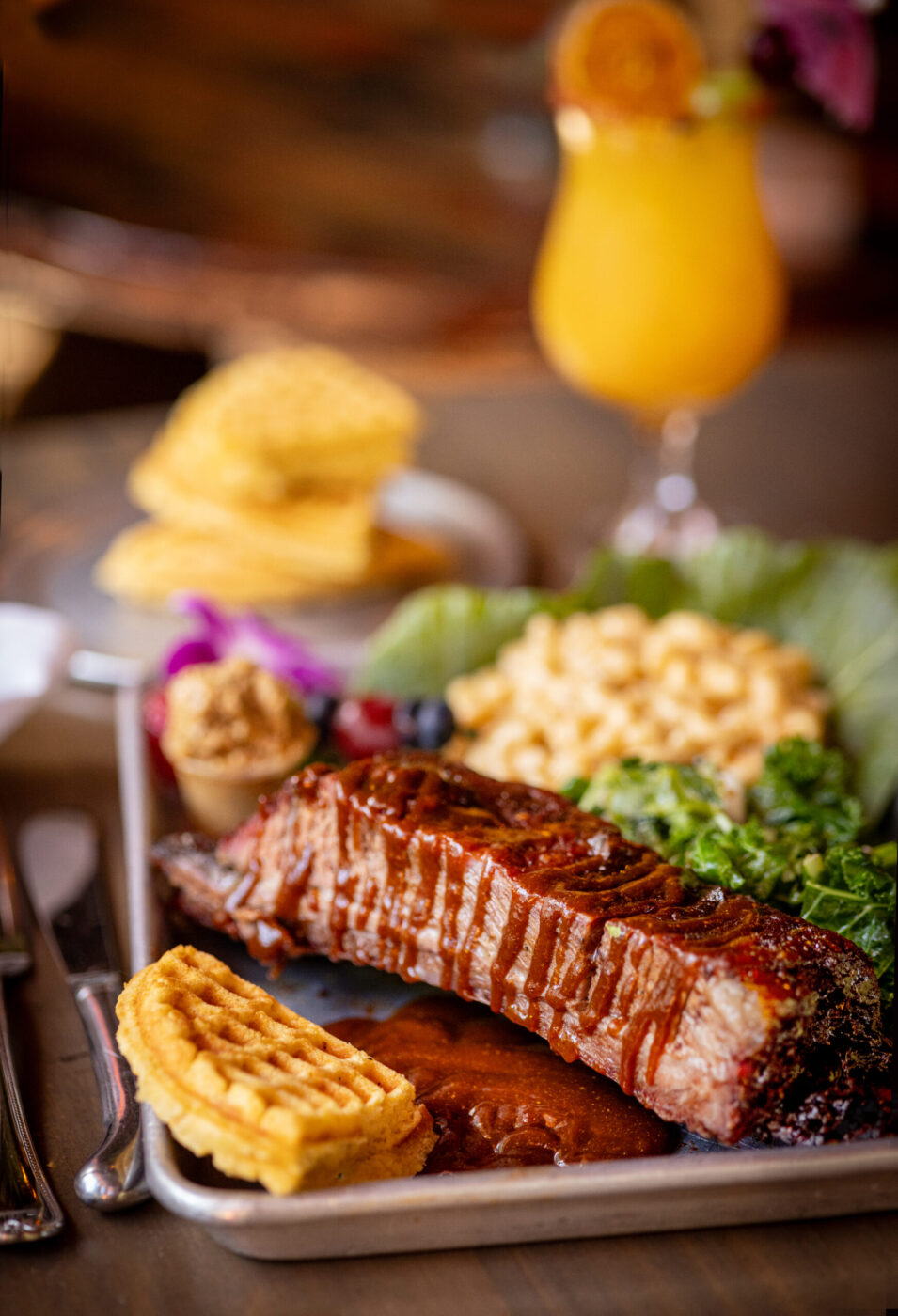 Beef Ribs with mac & cheese and cornbread waffles with crack butter from Saucy Mama’s Jook Joint Friday, July 18, 2026 in Guerneville. (John Burgess/The Press Democrat)
