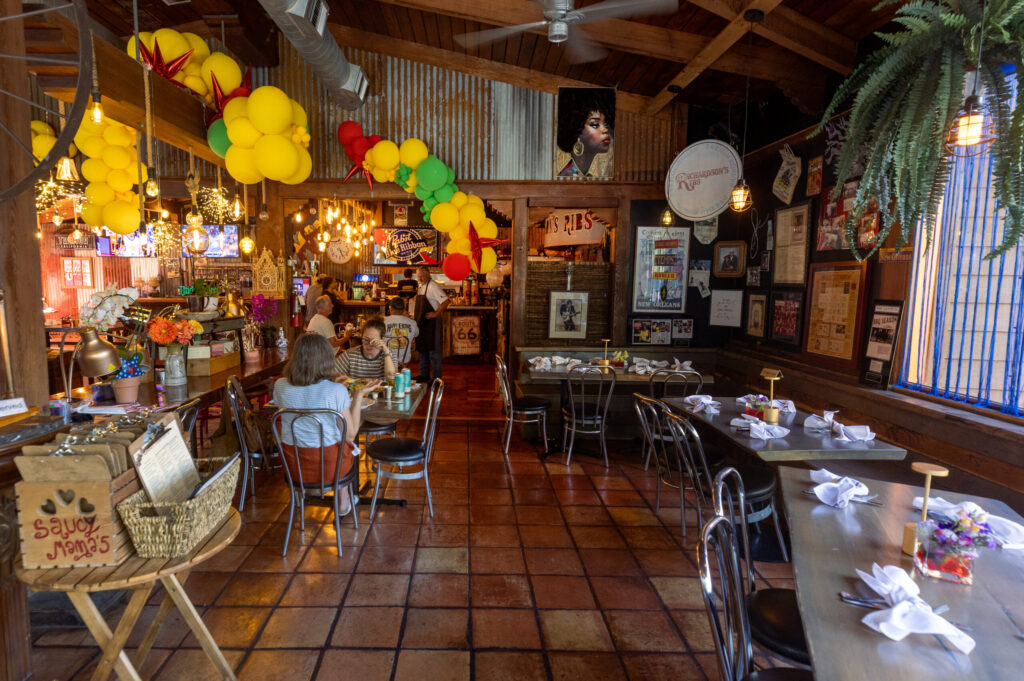 Half of the round dining room at Saucy Mama’s Jook Joint Friday, July 18, 2026 in Guerneville. (John Burgess/The Press Democrat)