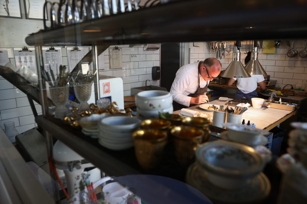 Troubadour Bread & Bistro owner/chef Sean McGaughey puts together a dish in Healdsburg on Thursday, July 2, 2026. (Christopher Chung/The Press Democrat)