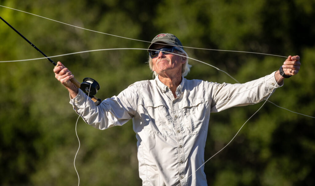 Russian River Fly Casters member Rick Baker pulls line for a longer cast while practicing Thursday, May 7, 2026 at the casting pond in Santa Rosa’s Galvan Park. (John Burgess/The Press Democrat)
