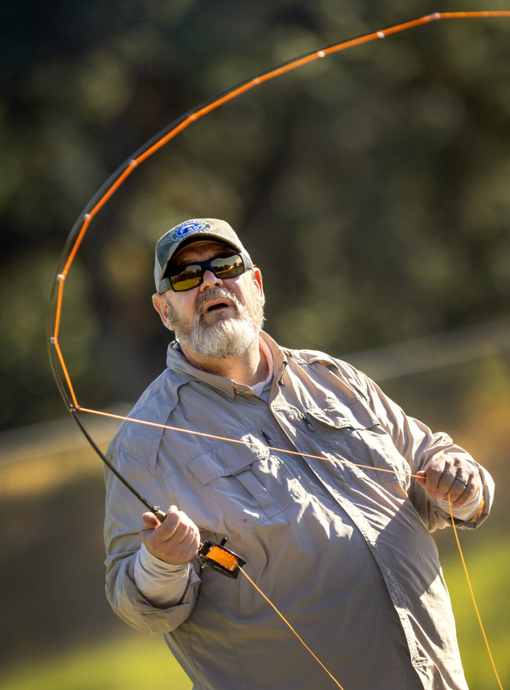 The Russian River Fly Casters member Rick Baker watches his line while practicing Thursday, May 7, 2026 at the casting pond in Galvin Park in Santa Rosa. (John Burgess/The Press Democrat)