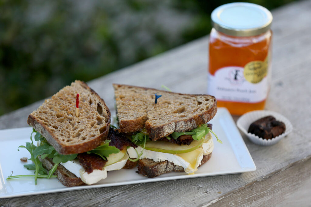 The Porky Peach Sandwich features homemade peach habanero jam, bacon, brie cheese, apples, and arugula at Society Bakery and Cafe in Sebastopol on Wednesday, September 22, 2021. (Beth Schlanker/The Press Democrat)
