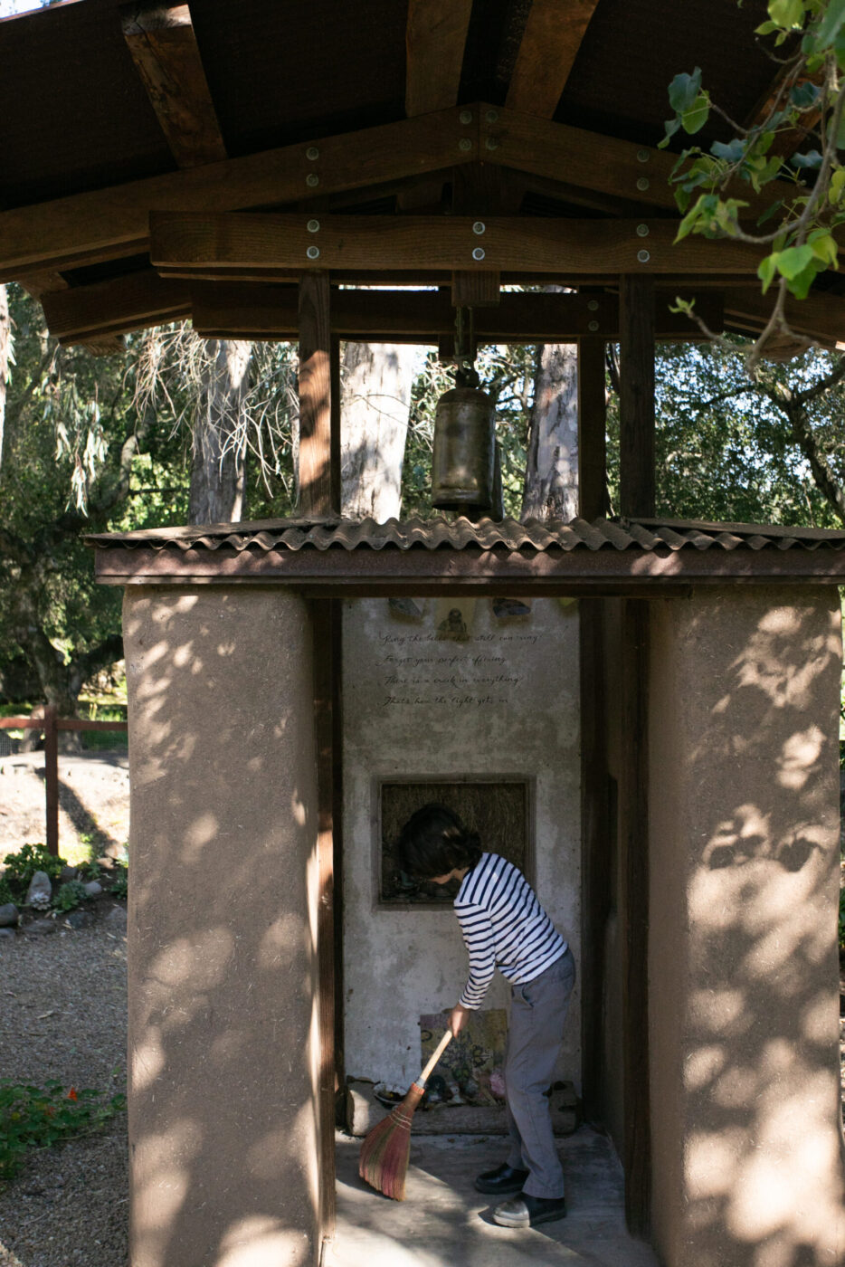 Westerbeke’s grandson sweeps the floor of a new bell tower. The structure offers a private sound bath experience, a place where ranch guests can enjoy moments of solitary reflection. (Eileen Roche)