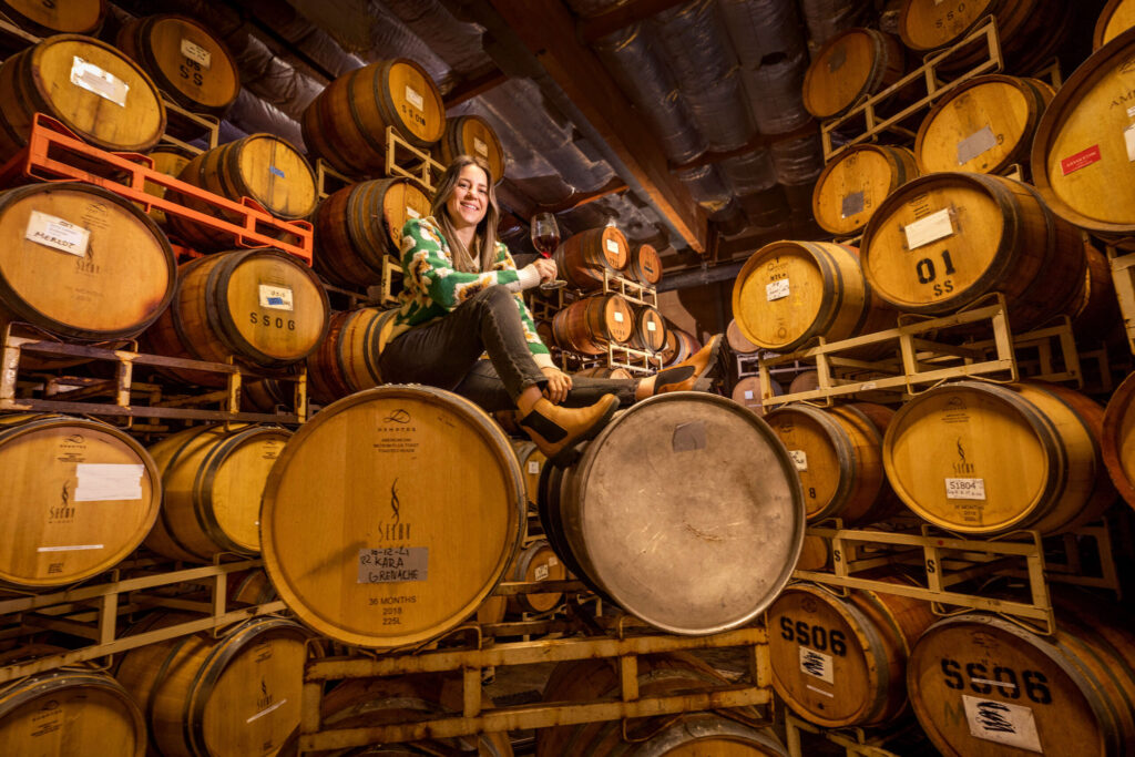 Kara Groom, owner of Kara Marie Wines, has been increasing her production each year. Groom shown in the barrel room of her shared Healdsburg production facility Thursday, December 8, 2022. (Photo by John Burgess/The Press Democrat)