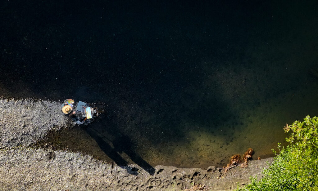 Christopher Leith Evans paints a scene along the Russian River near his home in Healdsburg on Monday, May 11, 2026. (Christopher Chung/The Press Democrat)