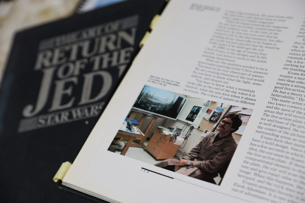 A photo of Christopher Leith Evans in a book about the making of Star Wars: Return of the Jedi”. Evans painted a variety of environments for the movie. Photo taken in Healdsburg on Monday, May 11, 2026. (Christopher Chung/The Press Democrat)