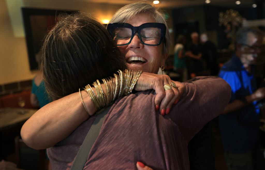 Lisbeth Holmefjord, right, the owner of Baci Cafe and Wine Bar, is greeted by Jacquelyn Wells as the restaurant is reopened, Wednesday, July 29, 2026, after a vehicle slammed through the front of the Healdsburg establishment in May. (Kent Porter / The Press Democrat)