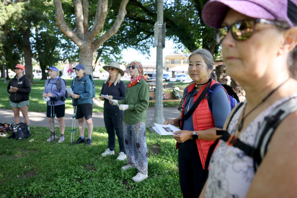 Pilgrims gather at Sonoma Plaza before heading out on Stage 1 of the Camino de Sonoma. The first leg of the six-day trek runs from Sonoma to Kenwood. Photo taken in Sonoma on Thursday, May 14, 2026. (Beth Schlanker / The Press Democrat)