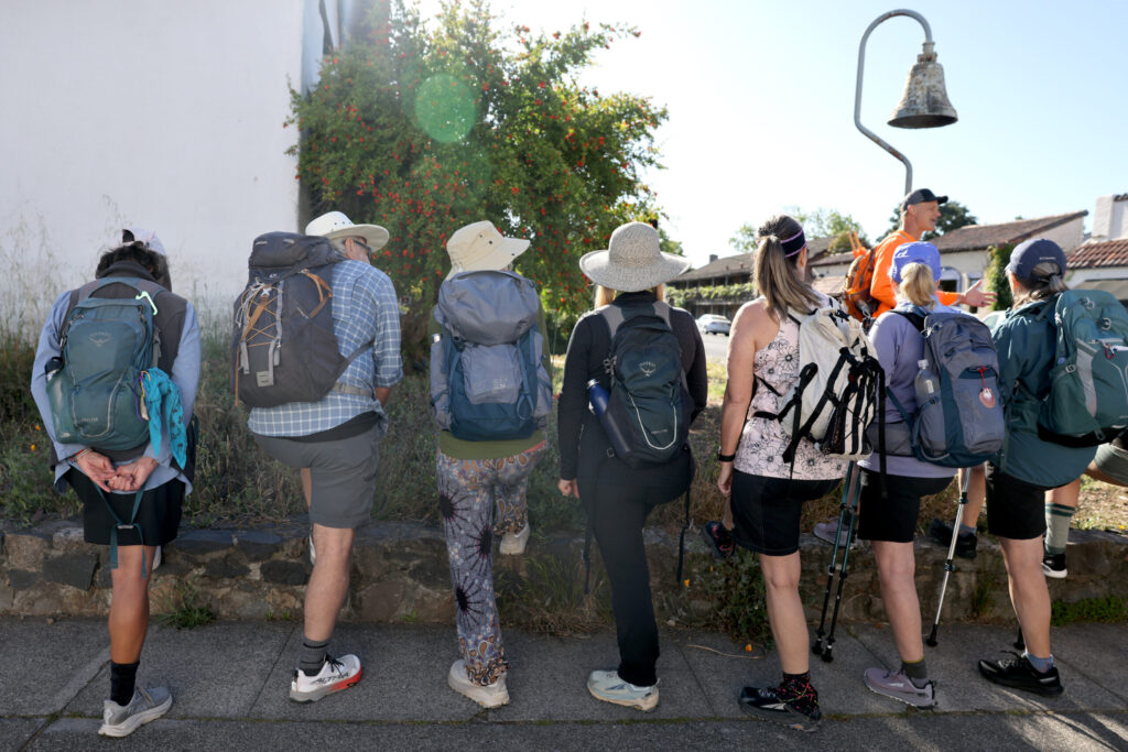 Pilgrims gather at Sonoma Plaza before heading out on Stage 1 of the Camino de Sonoma. Photo taken in Sonoma on Thursday, May 14, 2026. (Beth Schlanker / The Press Democrat)